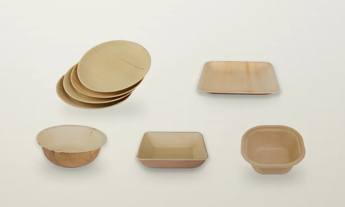 Five sample products: palm leaf plates and bowls and a bagasse container